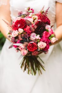 Bride holds a beautiful bouquet of flowers